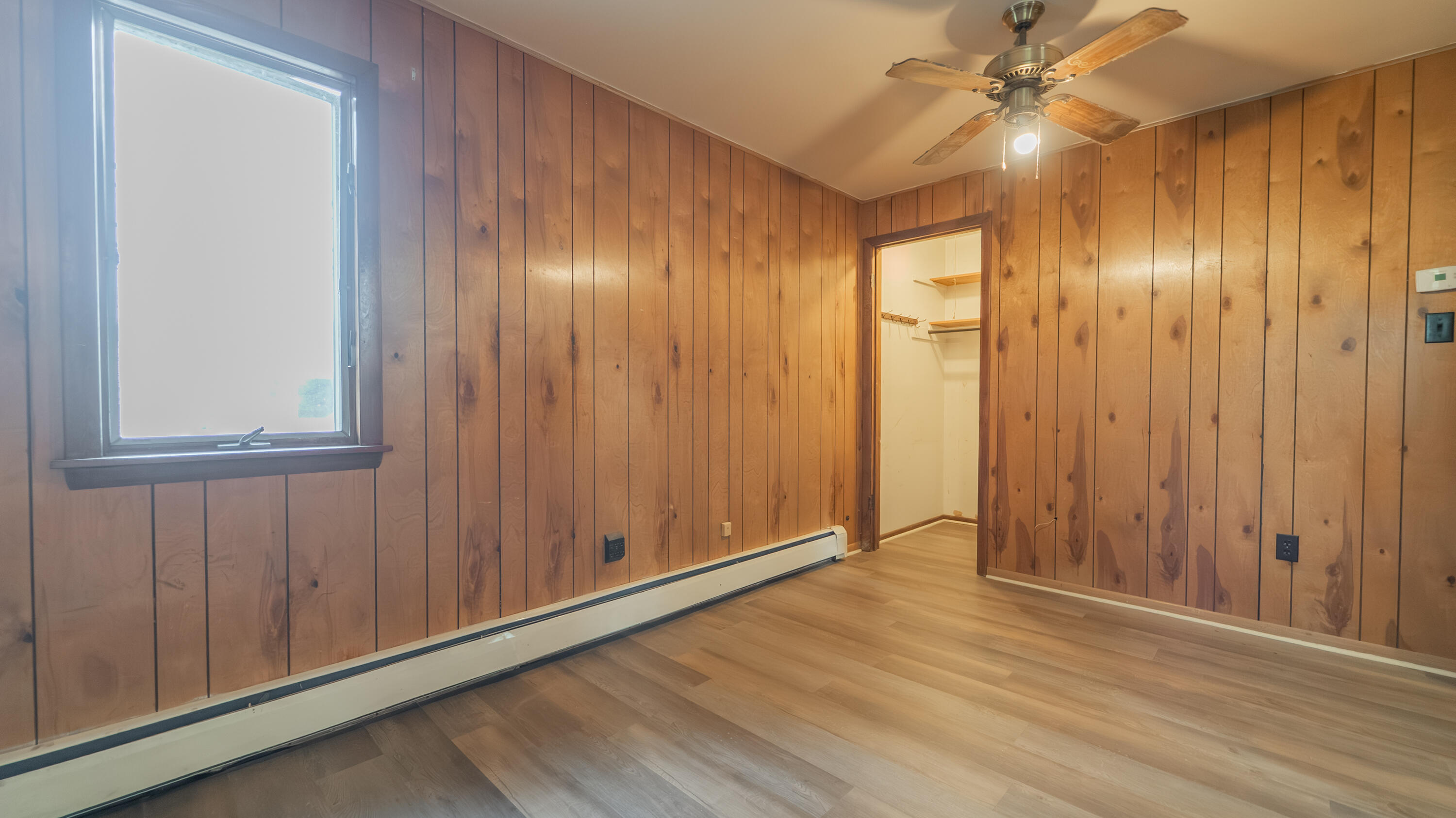 1916 Wespark Avenue Whiting, IN 46394 - Photo 18 of 32 an empty room with wooden floor closet and windows