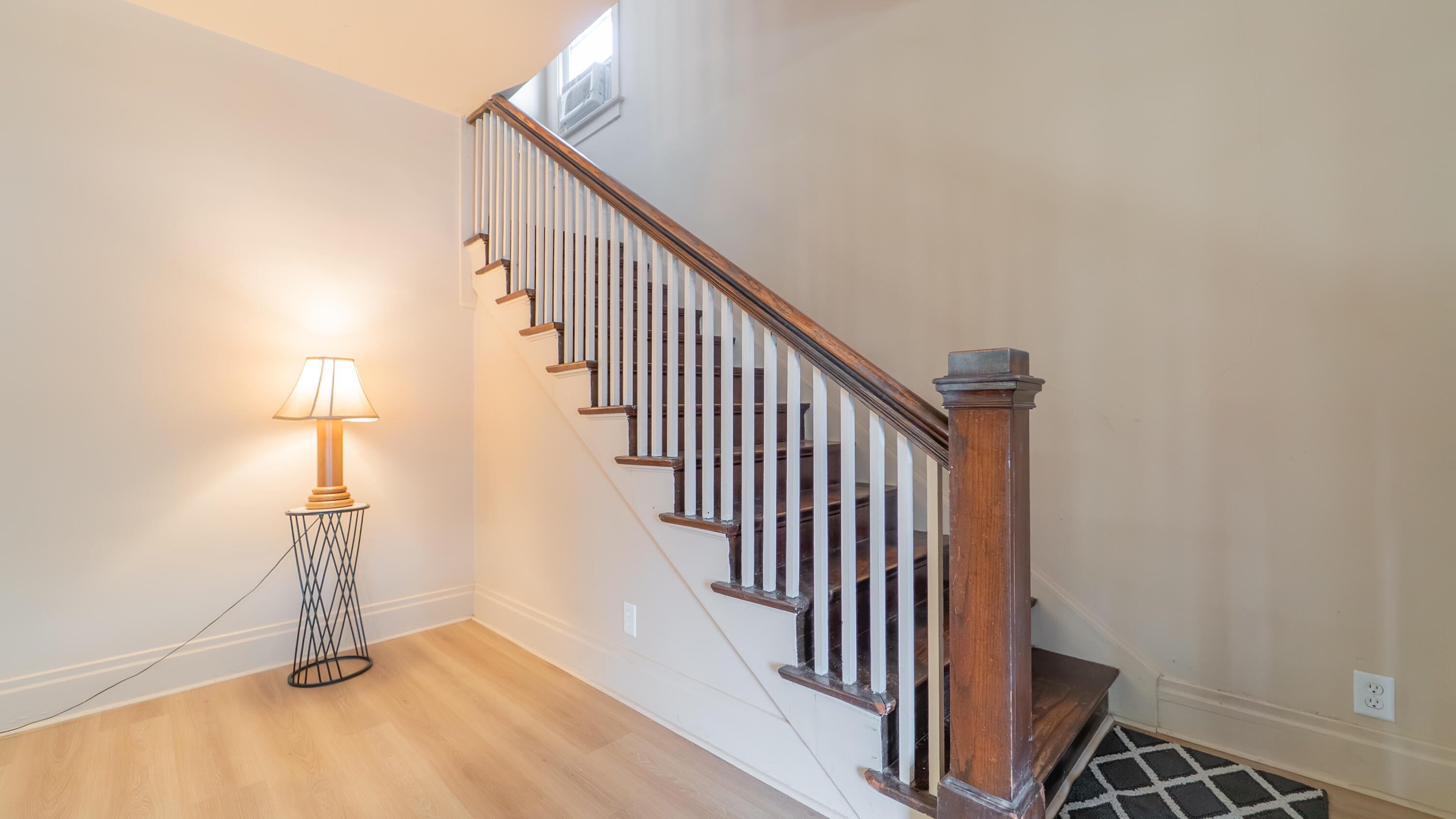 1916 Wespark Avenue Whiting, IN 46394 - Photo 21 of 32 a view of a hallway with wooden floor and staircase