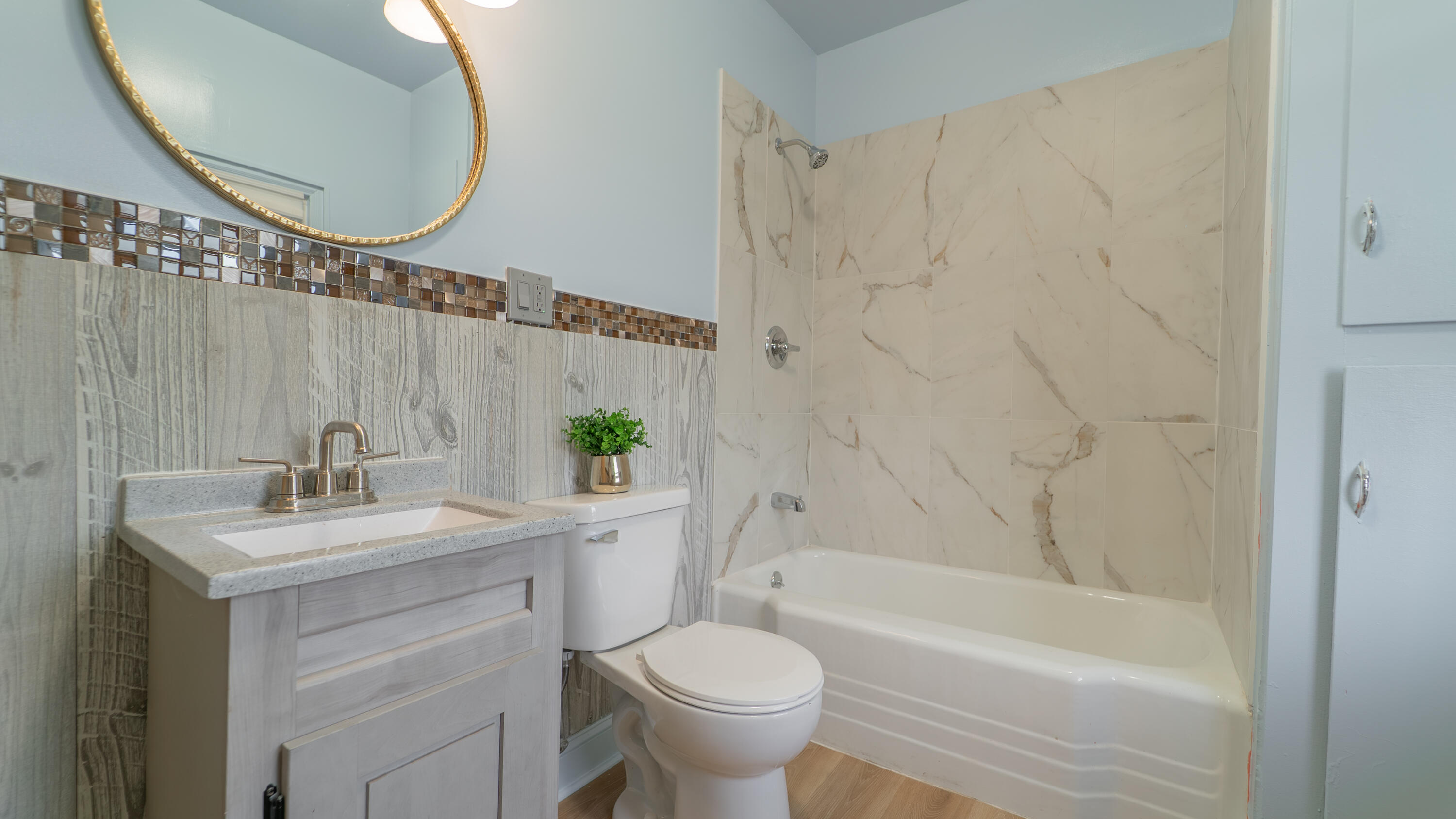 1916 Wespark Avenue Whiting, IN 46394 - Photo 22 of 32 a bathroom with a sink a toilet and a mirror