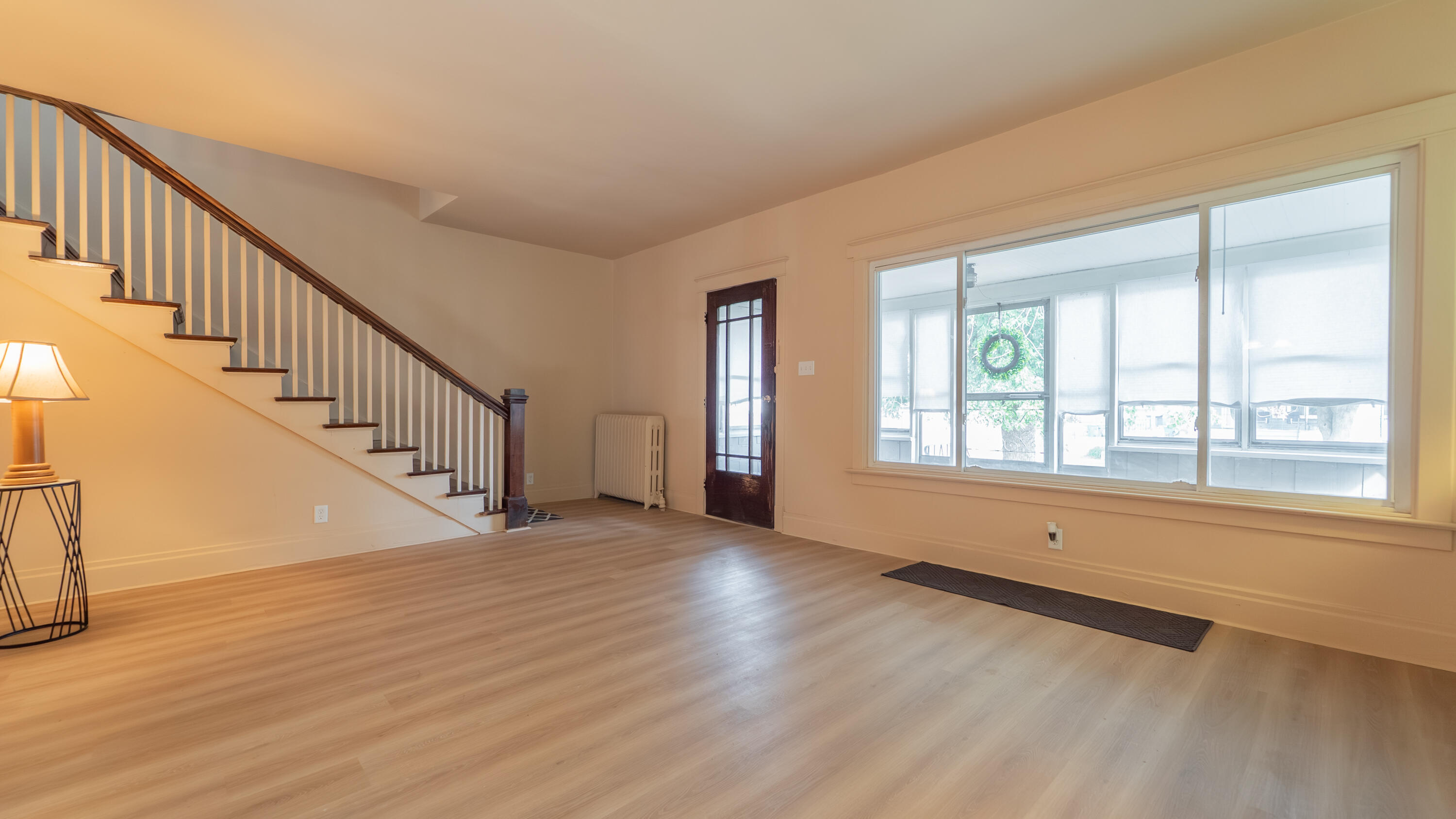 1916 Wespark Avenue Whiting, IN 46394 - Photo 3 of 32 a view of an empty room with wooden floor and a window