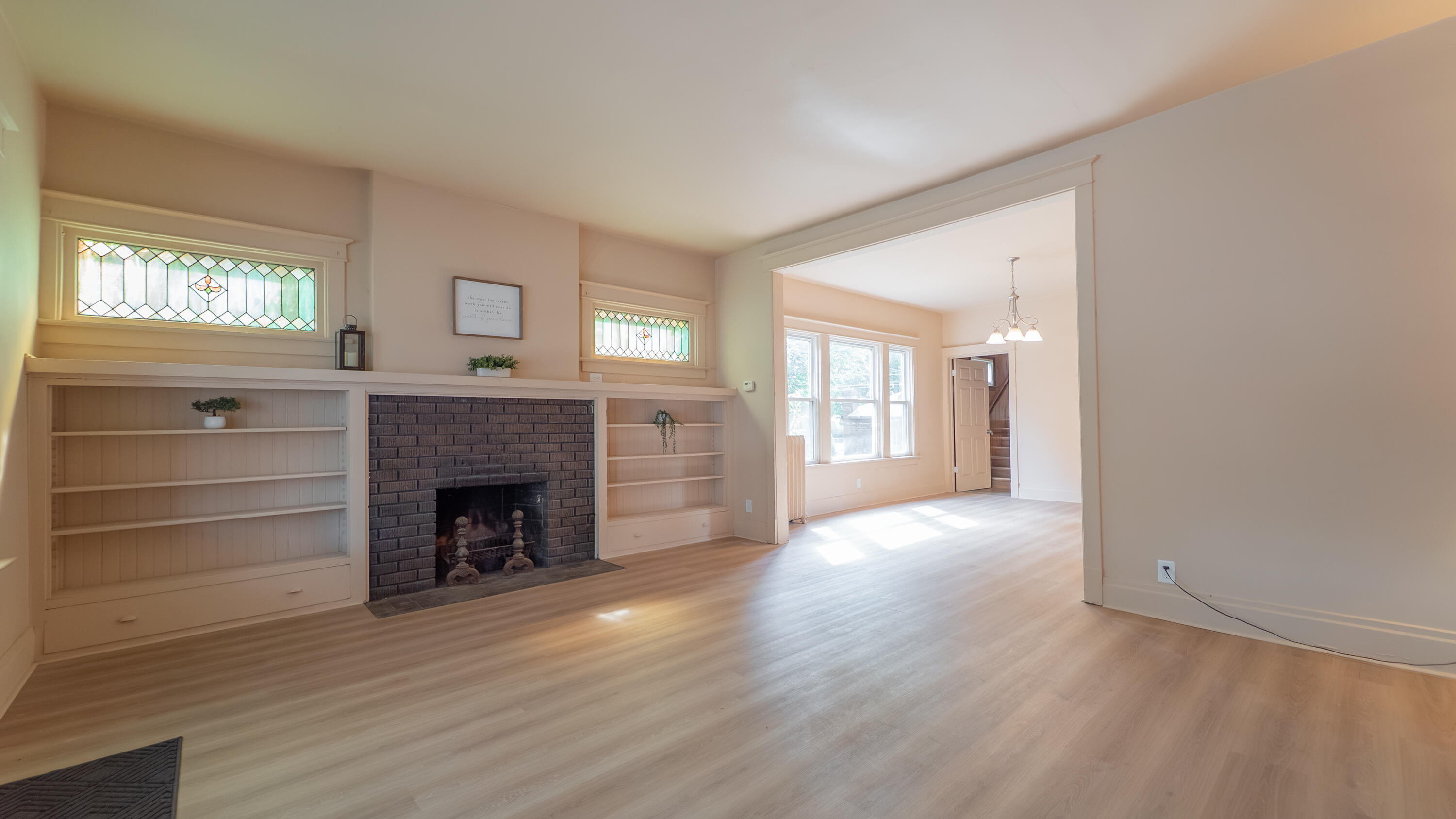 1916 Wespark Avenue Whiting, IN 46394 - Photo 7 of 32 a view of an empty room with a fireplace and a window