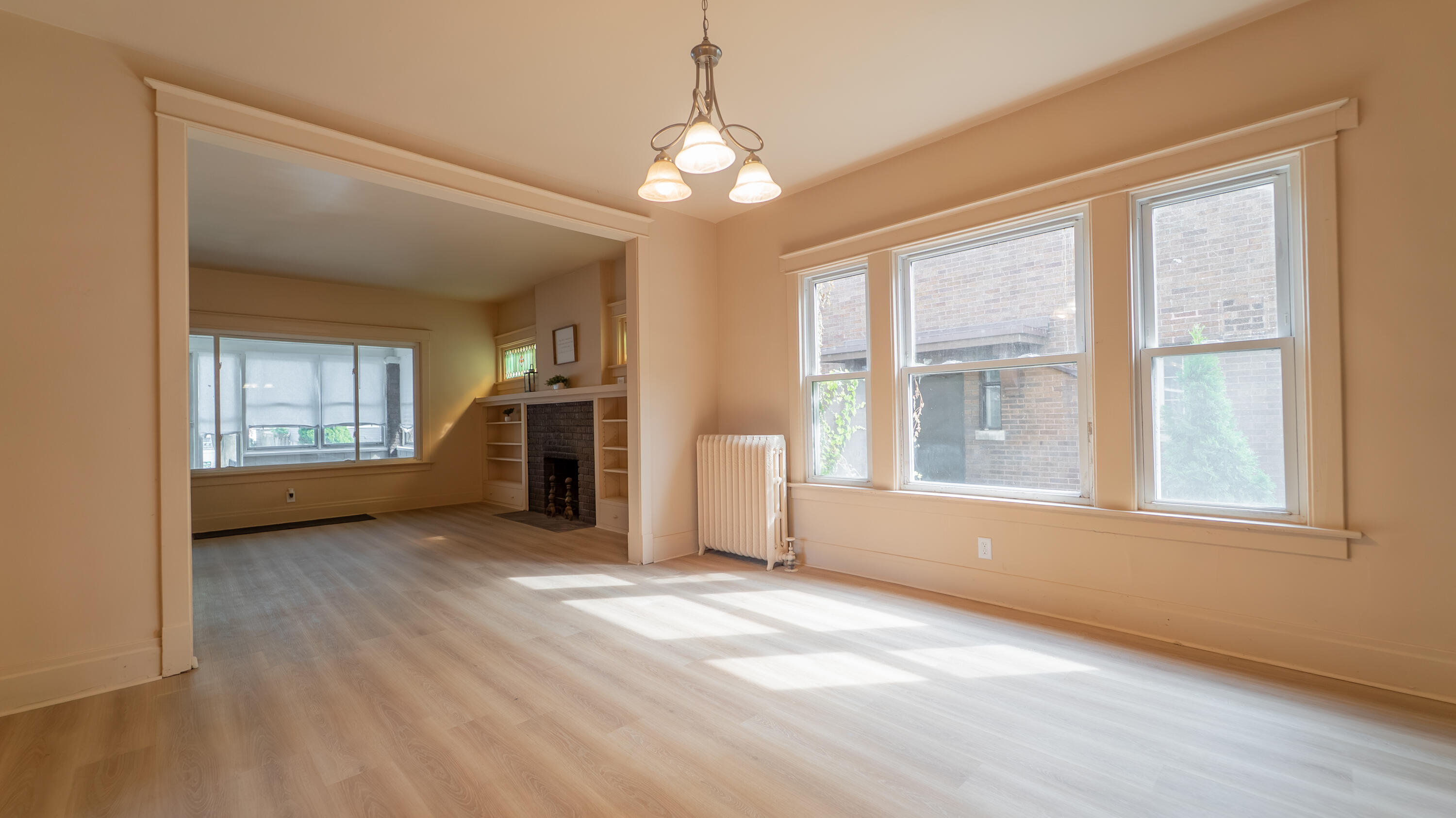 1916 Wespark Avenue Whiting, IN 46394 - Photo 9 of 32 an empty room with chandelier and windows