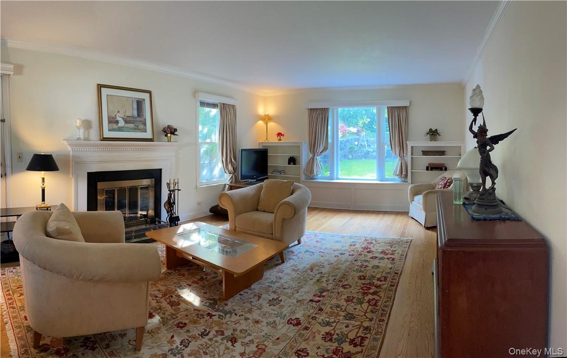 261 Fox Meadow Road Scarsdale, NY 10583 - Photo 2 of 18 View of the formal living room with bay window and wood burning fireplace