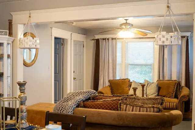 a bedroom with a bed and a mirror