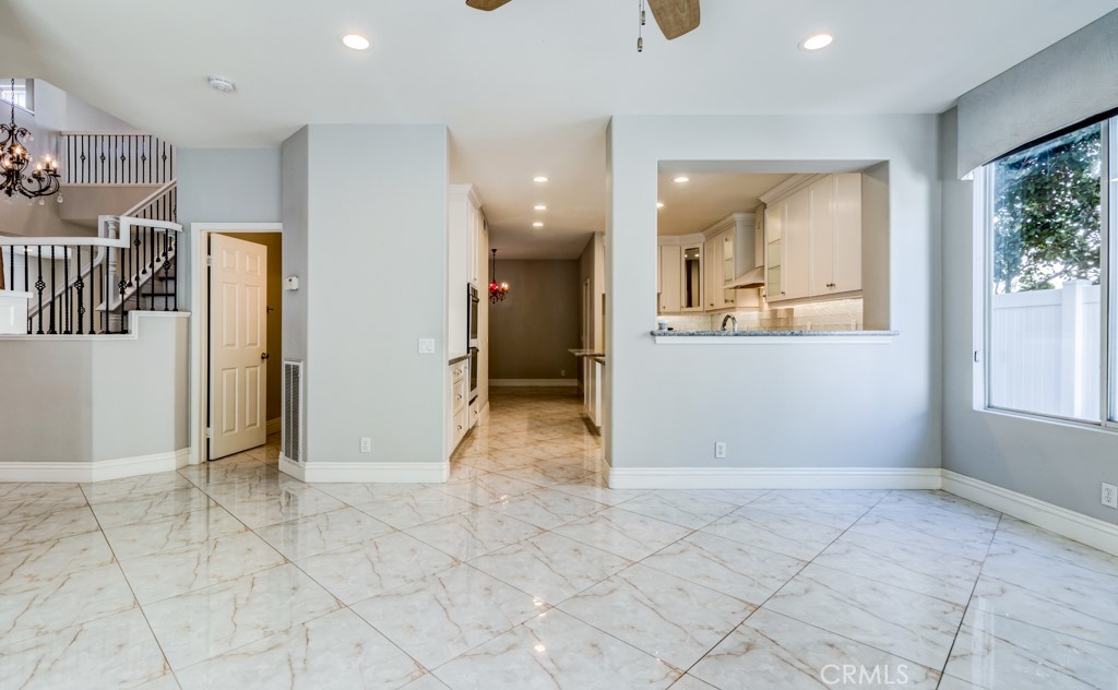8 Zinnia Irvine, CA 92618 - Photo 12 of 39 a view of a big room with entryway and wooden floor