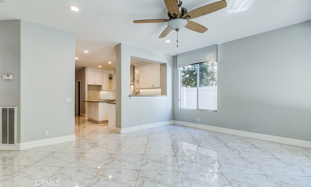 8 Zinnia Irvine, CA 92618 - Photo 13 of 39 a view of a kitchen with a microwave and a refrigerator