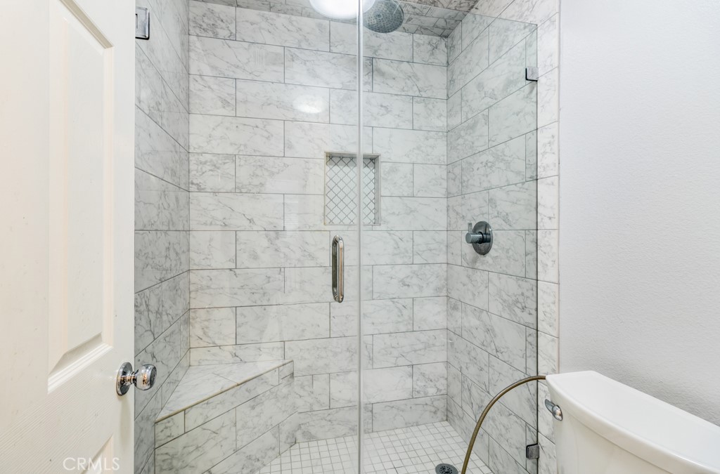 8 Zinnia Irvine, CA 92618 - Photo 34 of 39 a bathroom with a toilet and shower