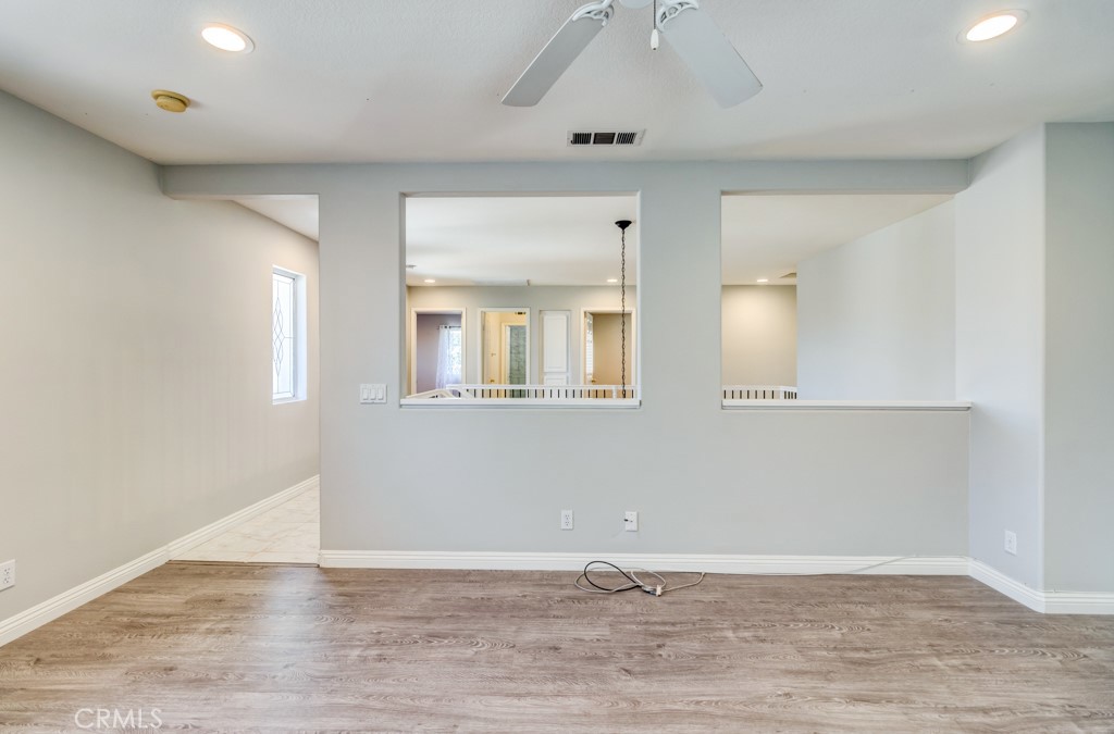 8 Zinnia Irvine, CA 92618 - Photo 39 of 39 a view of an empty room with wooden floor and a window