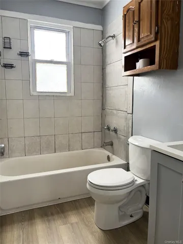 a bathroom with a toilet a sink and bathtub