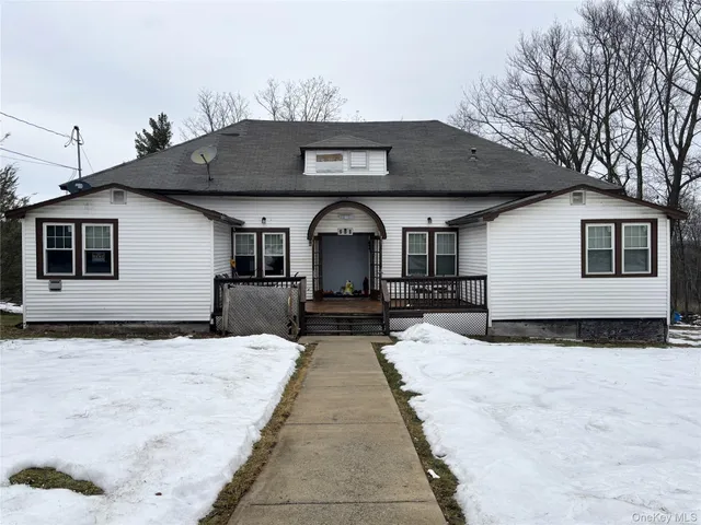 a front view of a house with glass windows