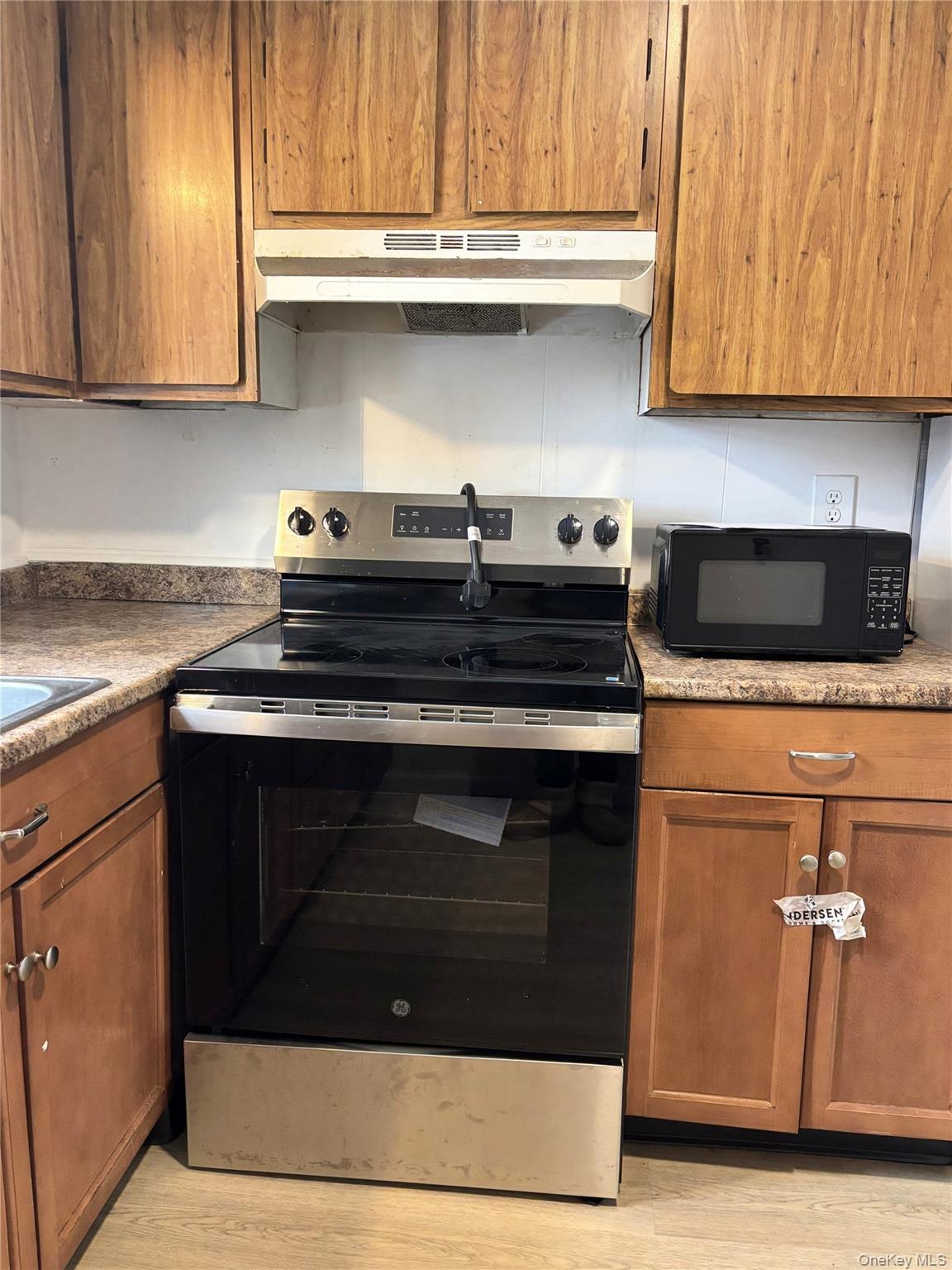 210 Mt Prosper Road Wurtsboro, NY 12790 - Photo 5 of 14 a stove top oven sitting inside of a kitchen