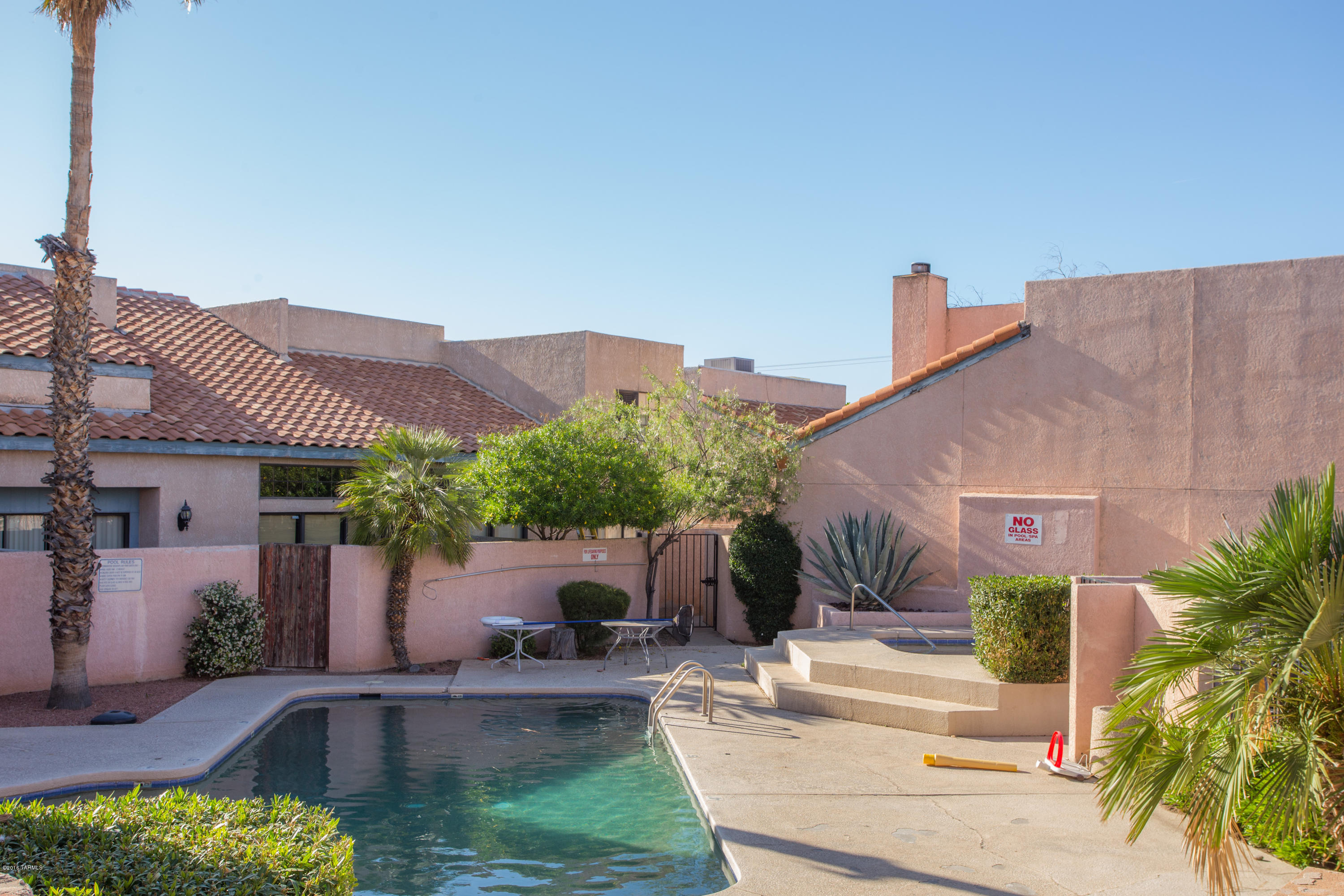 242 East Pastime Road Tucson, AZ 85705 - Photo 20 of 20 a front view of a house with garden