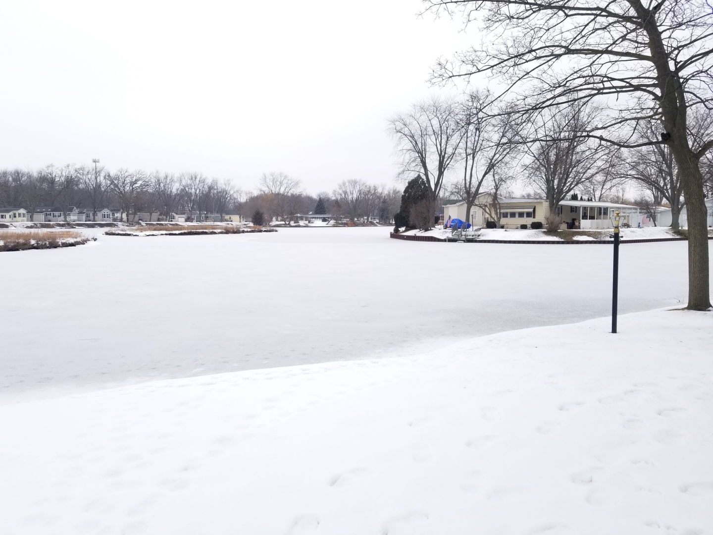 248 Bayview Road Elgin, IL 60123 - Photo 12 of 13 a view of lake with a yard
