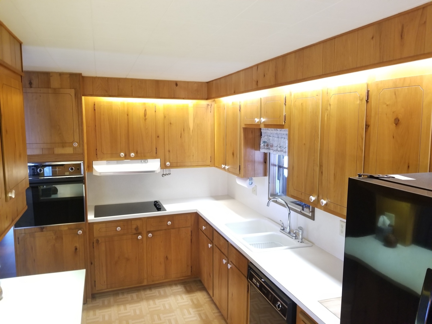 248 Bayview Road Elgin, IL 60123 - Photo 6 of 13 a kitchen with stainless steel appliances a sink dishwasher and microwave with wooden floor