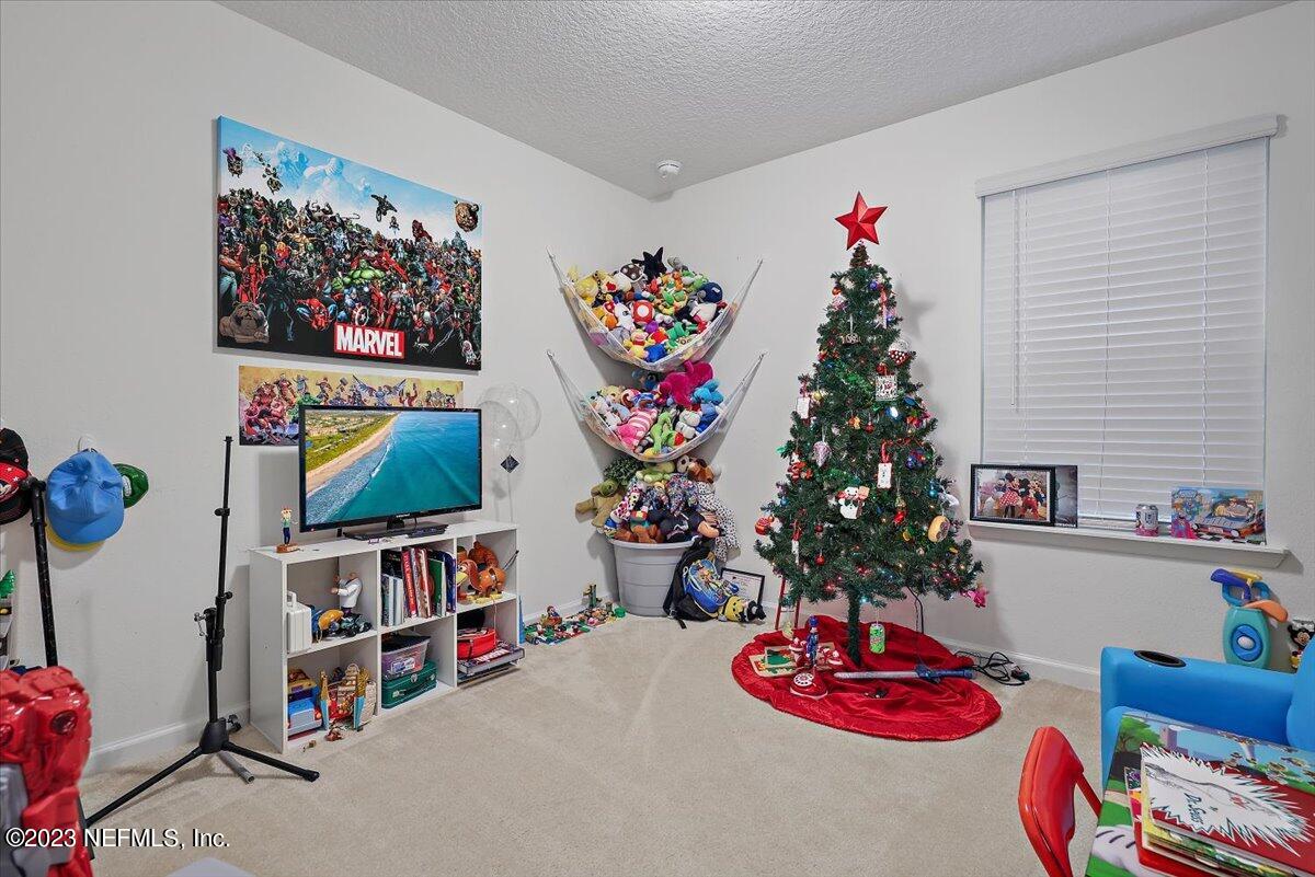 8300 Guild Way Jacksonville, FL 32222 - Photo 11 of 18 a living room with furniture and a potted plant