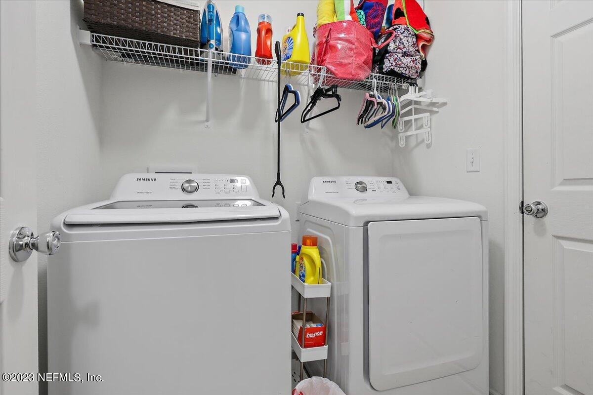 8300 Guild Way Jacksonville, FL 32222 - Photo 16 of 18 a utility room with dryer and washer