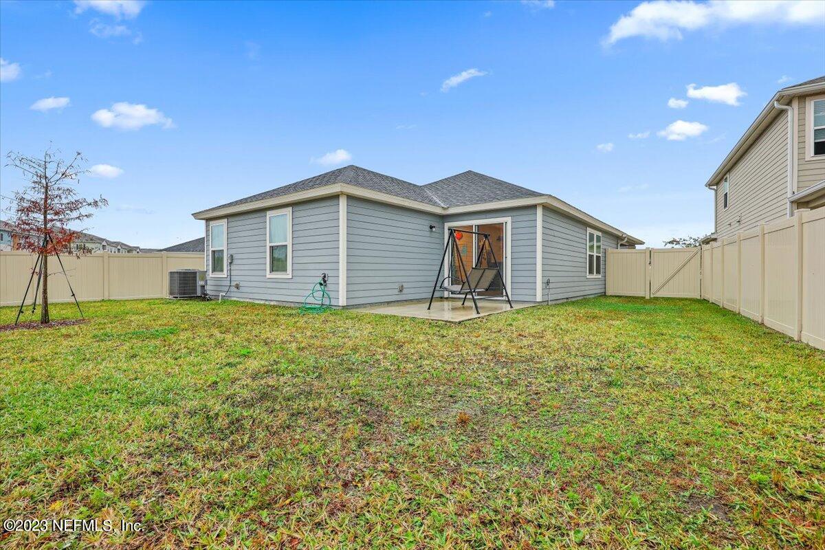 8300 Guild Way Jacksonville, FL 32222 - Photo 18 of 18 a front view of a house with a garden