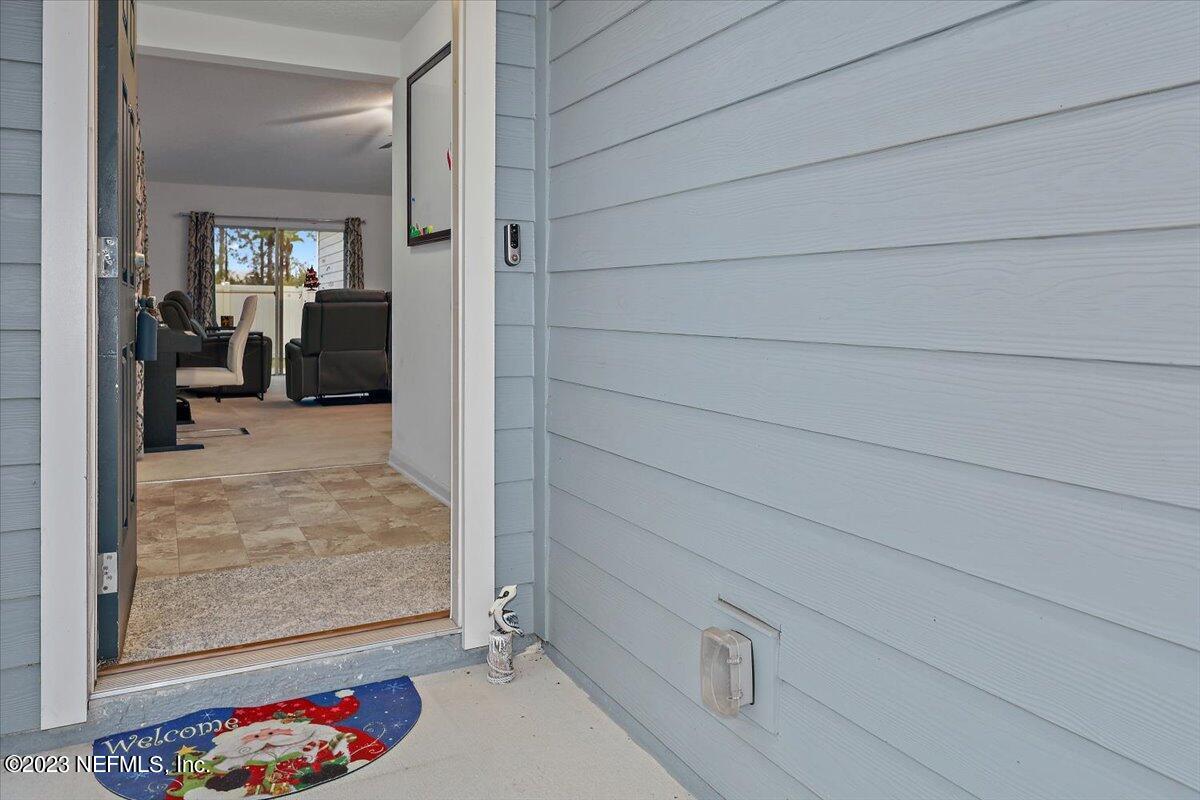 8300 Guild Way Jacksonville, FL 32222 - Photo 2 of 18 a view of livingroom with furniture and front door