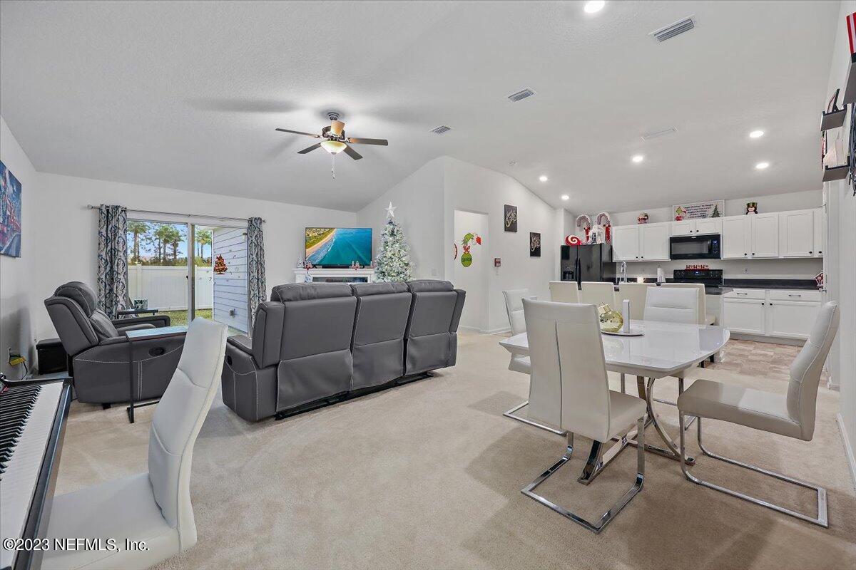 8300 Guild Way Jacksonville, FL 32222 - Photo 4 of 18 a living room with furniture and kitchen view