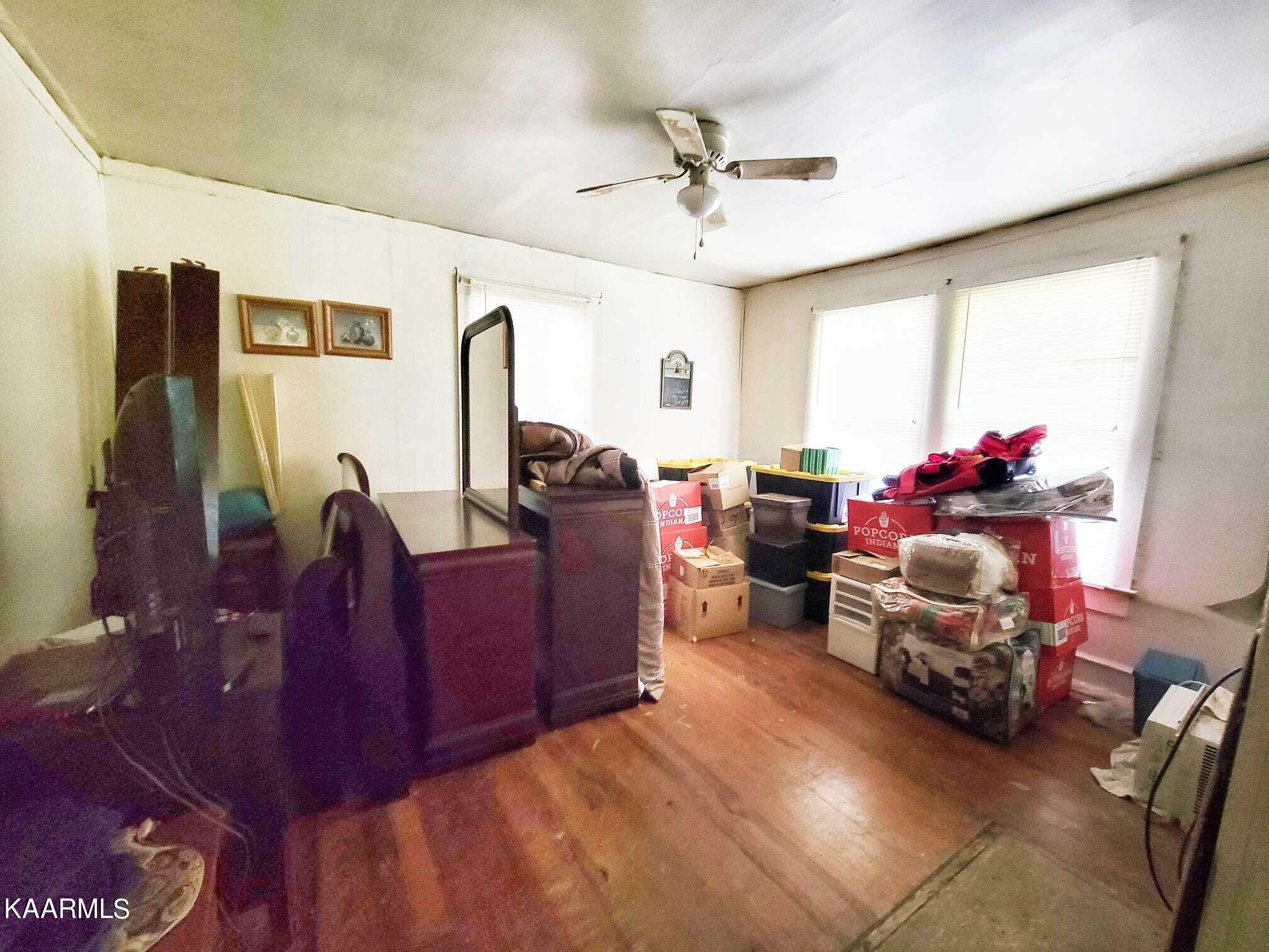 104 Highway 160 Newport, TN 37821 - Photo 17 of 24 a living room with furniture and a chandelier