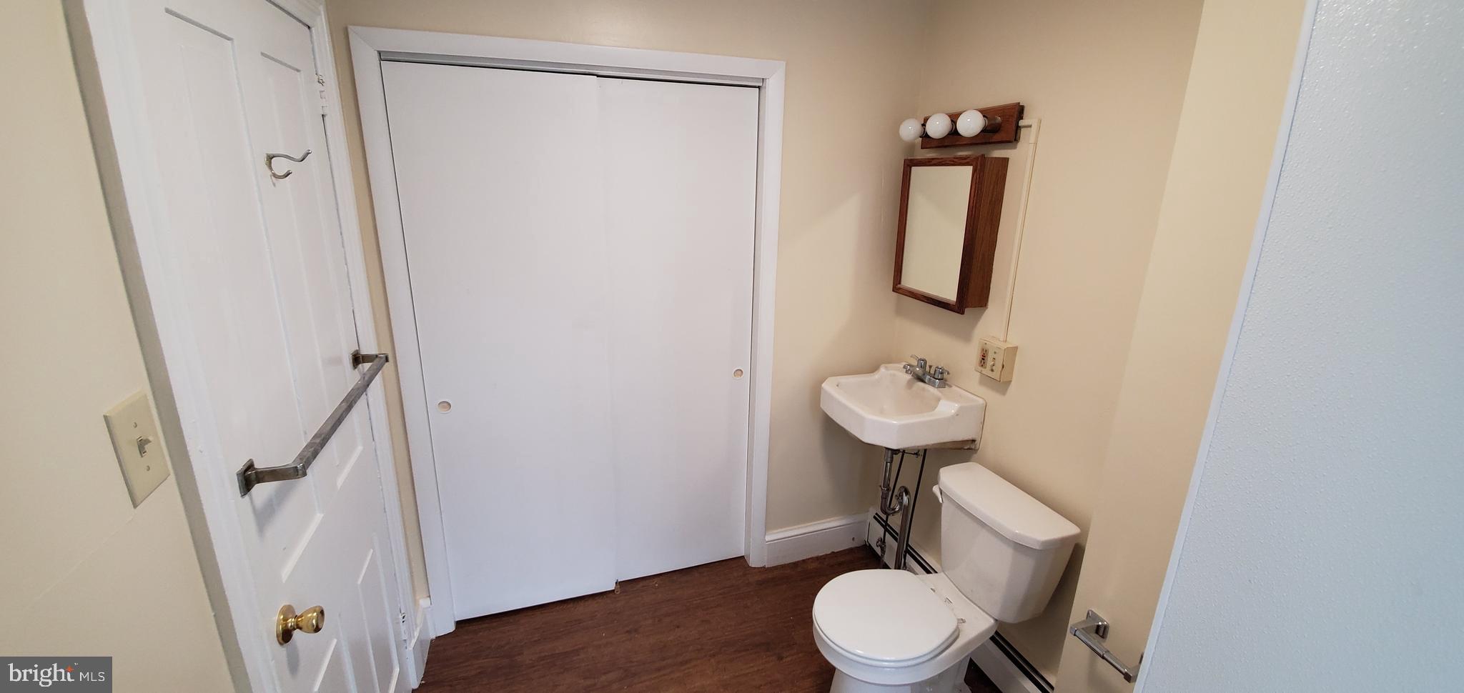 128 New Street Spring City, PA 19475 - Photo 12 of 12 a bathroom with a toilet a sink and a mirror
