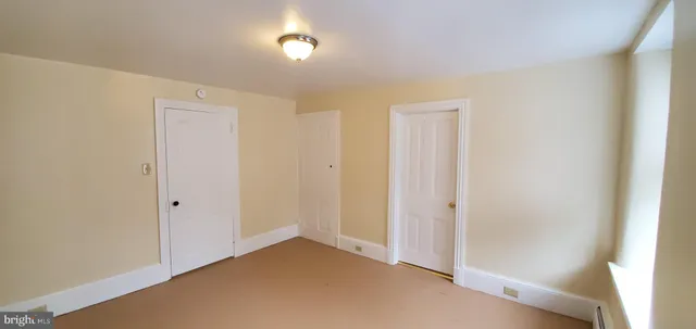 an empty room with a hallway