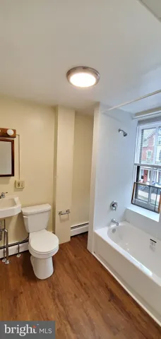a bathroom with a bathtub and a toilet