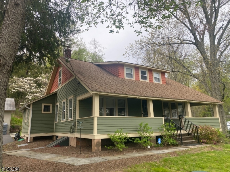 137 Mountain Avenue Gillette, NJ 07933 - Photo 1 of 17 a front view of a house with garden