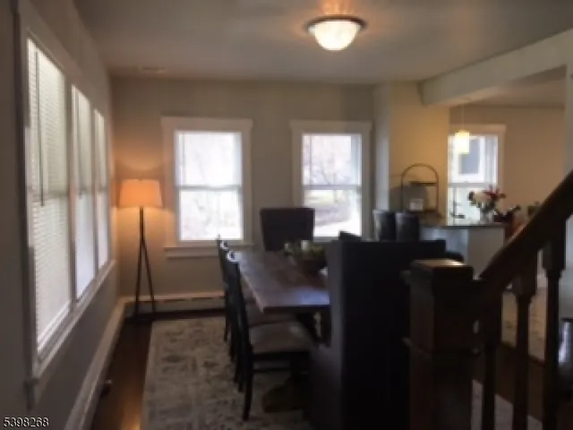 a kitchen with a sink cabinets and wooden floor