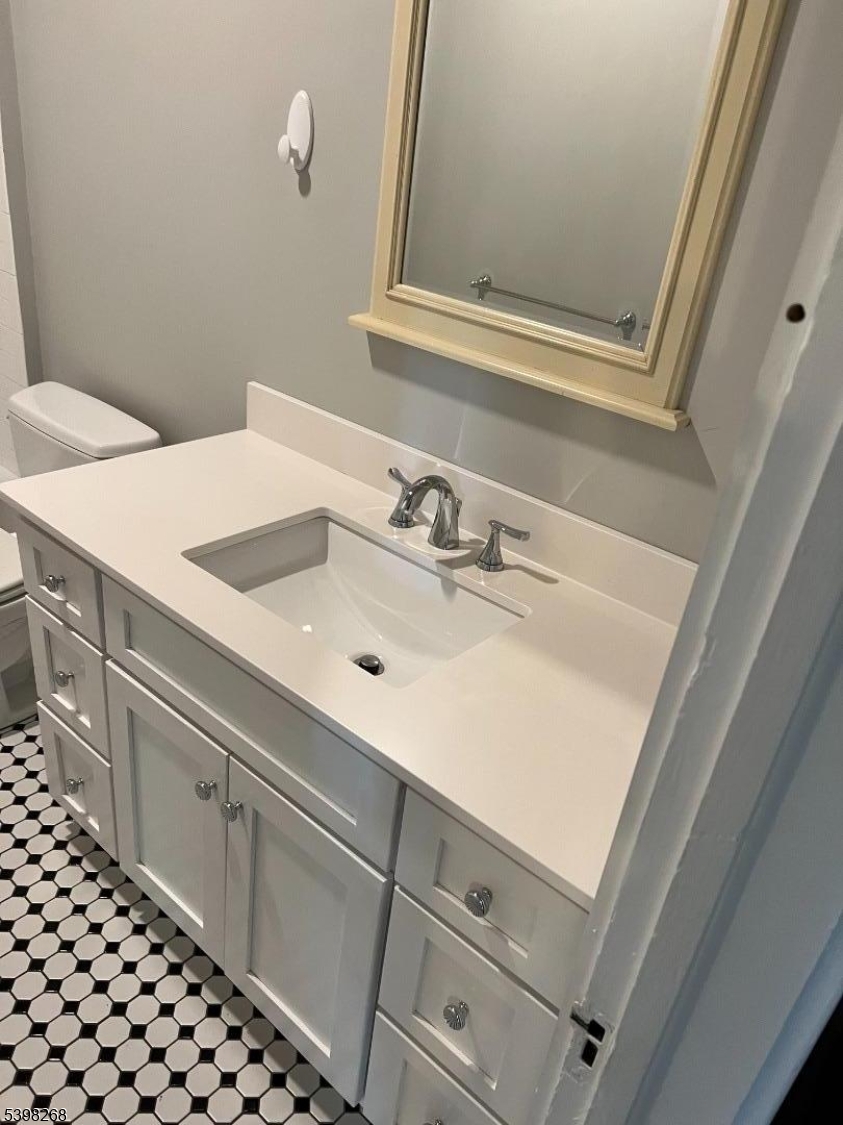 137 Mountain Avenue Gillette, NJ 07933 - Photo 16 of 17 a bathroom with a sink and a mirror