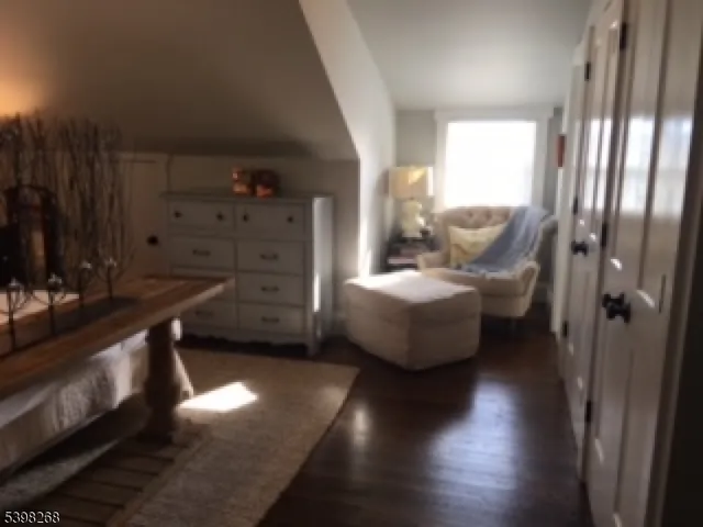 a view of hall way with furniture and window