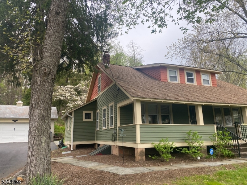 137 Mountain Avenue Gillette, NJ 07933 - Photo 2 of 17 a front view of a house with a yard