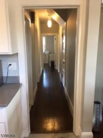 a view of a dining room with furniture and a window