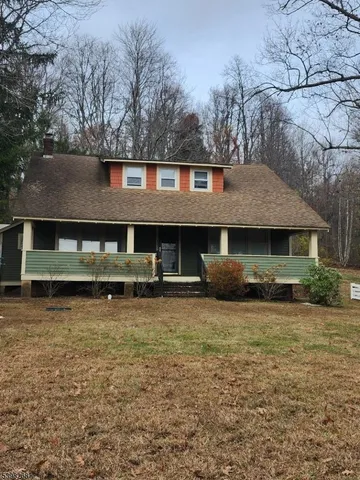 a front view of a house with yard