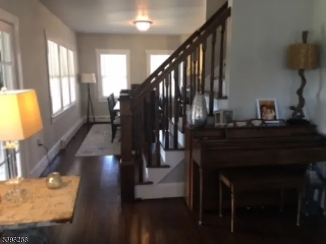 a bathroom with a granite countertop sink toilet a shower and a mirror