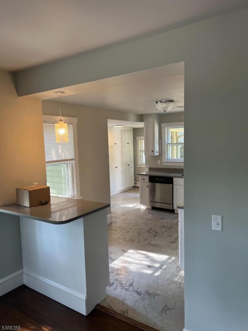 137 Mountain Avenue Gillette, NJ 07933 - Photo 9 of 17 a view of a kitchen cabinets and a wooden floor