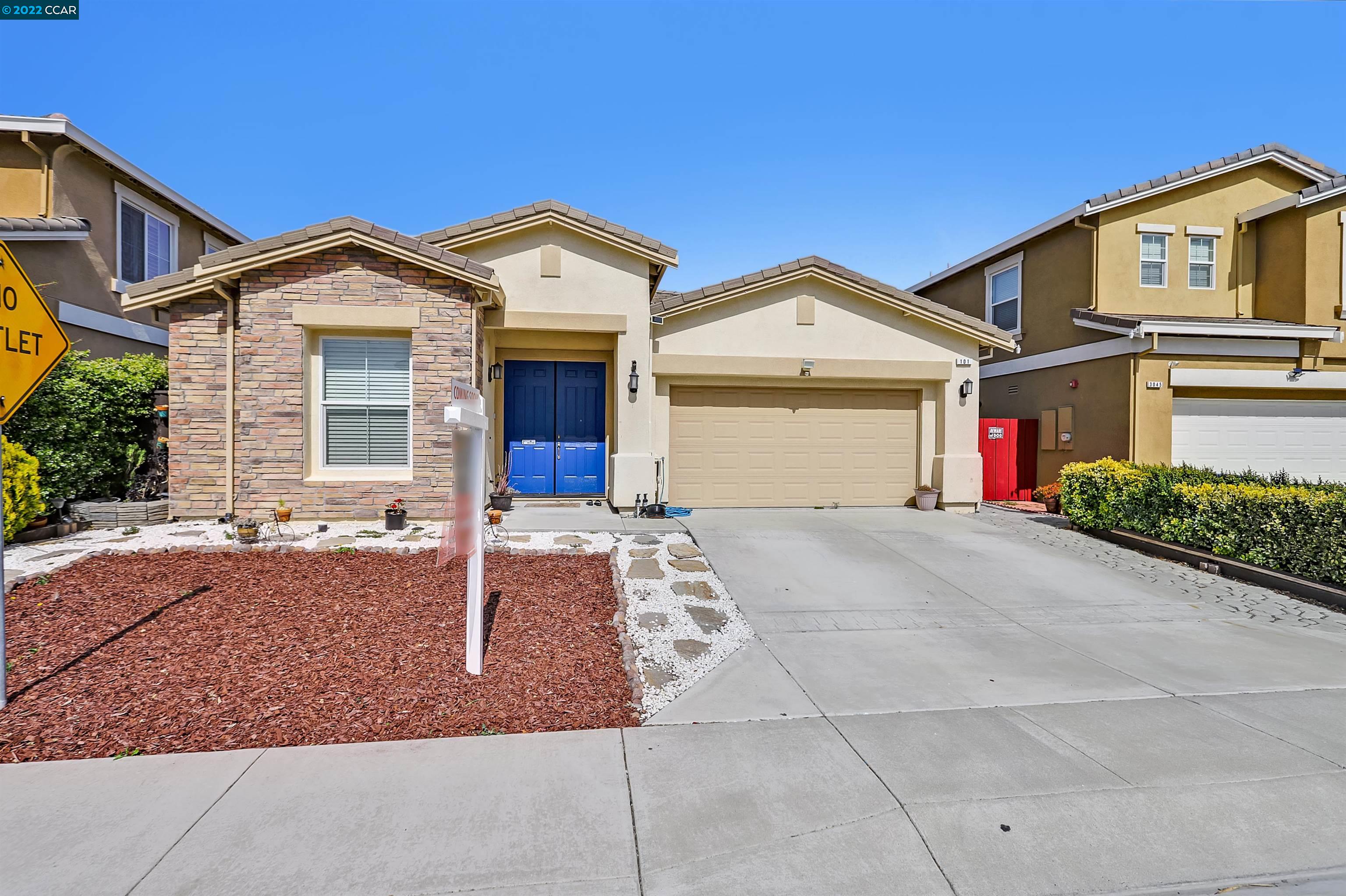 101 Rancho Bernado Court Bay Point, CA 94565 - Photo 1 of 1 a front view of a house with a yard and garage