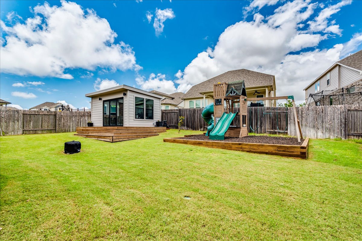 212 Sierra Blanca Road Dripping Springs, TX 78620 - Photo 4 of 37 Backyard with 160 sq ft ADU for office, man cave, she shed, or workout room.