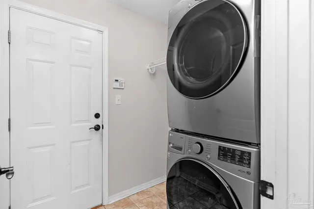 a view of storage and utility room with washer and dryer
