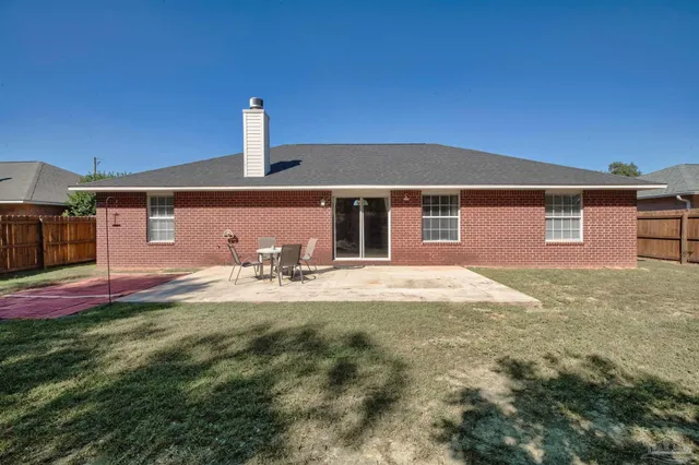 a front view of a house with yard