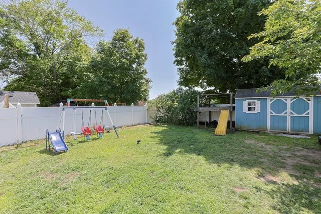 a view of a backyard with a tree