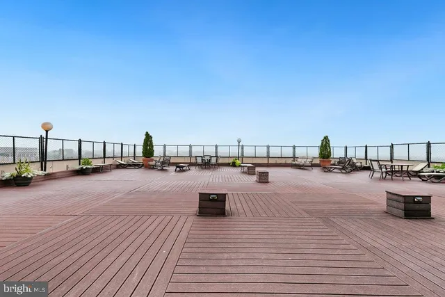 a view of roof deck with seating space