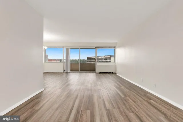 a view of a kitchen with wooden floor