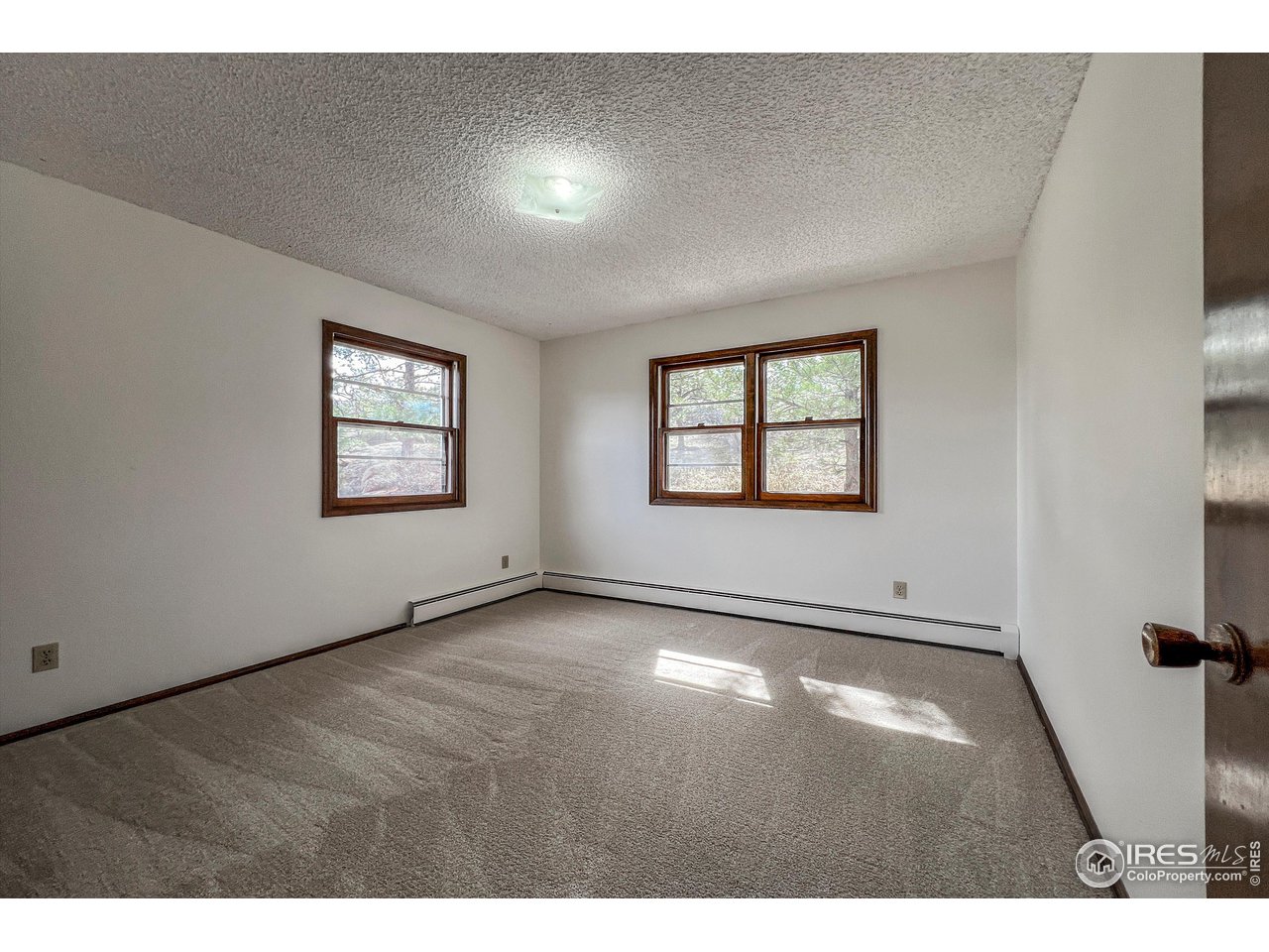 135 Lake Drive Lyons, CO 80540 - Photo 11 of 39 a view of an empty room with a window