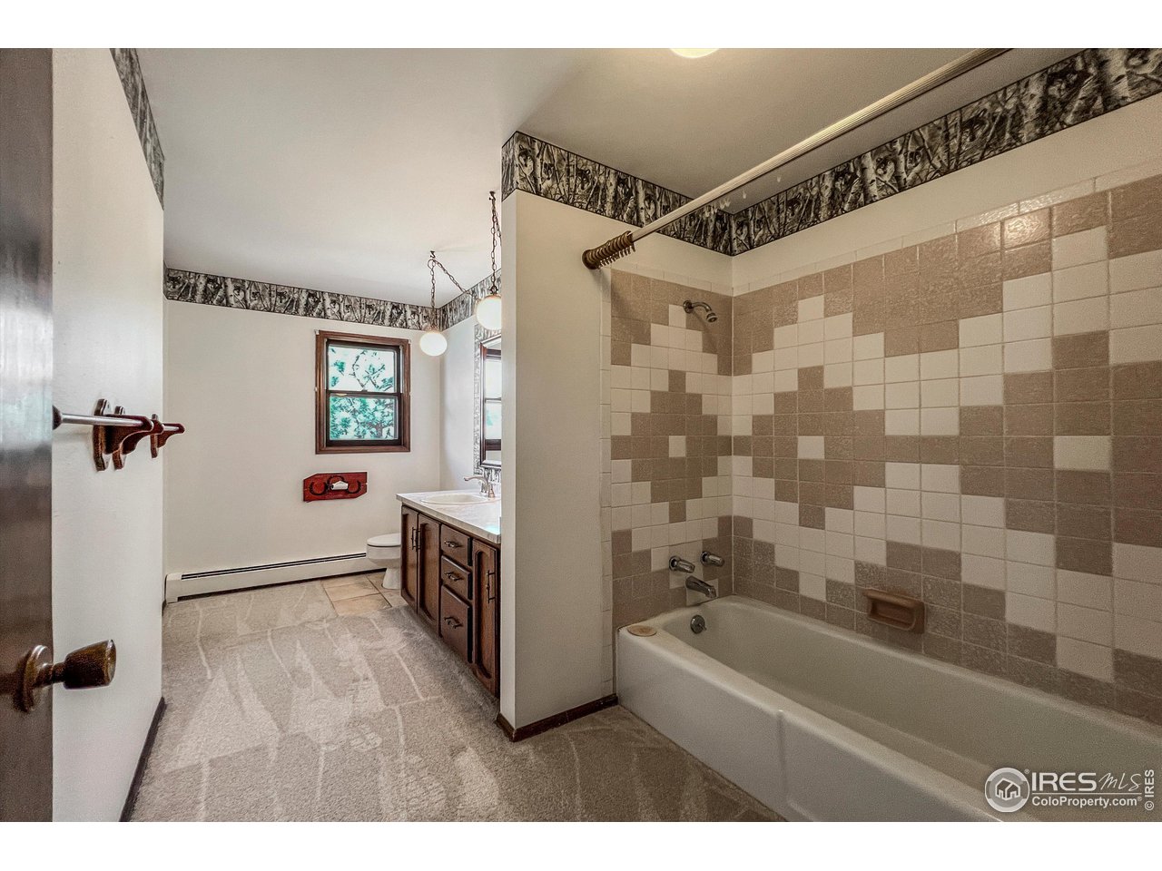135 Lake Drive Lyons, CO 80540 - Photo 12 of 39 a bathroom with a bathtub and a shower