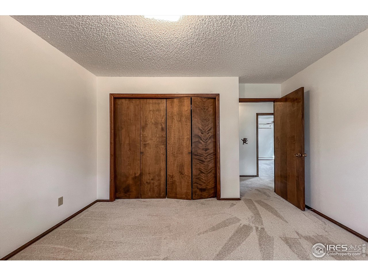 135 Lake Drive Lyons, CO 80540 - Photo 13 of 39 a view of an empty room with wooden floor