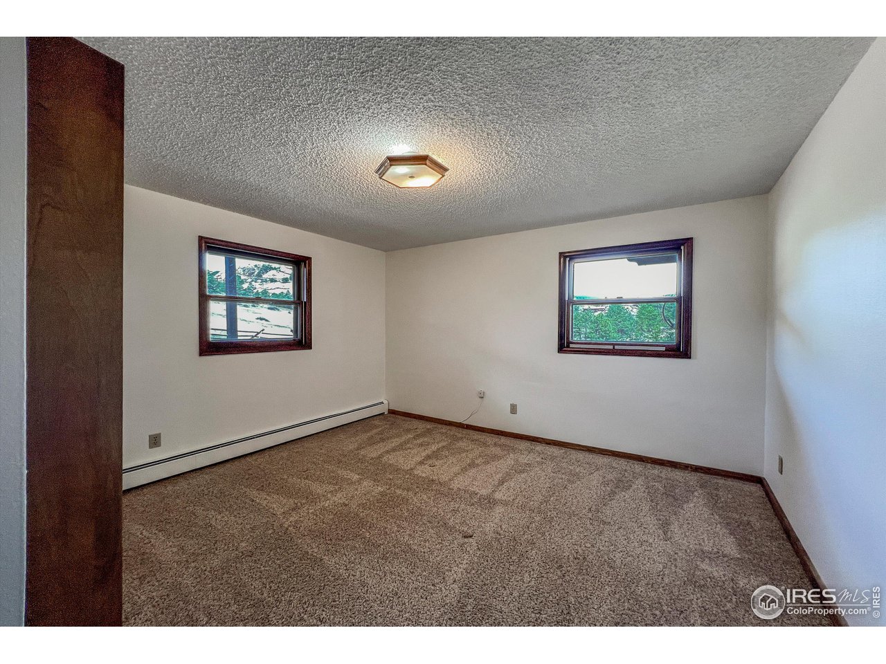 135 Lake Drive Lyons, CO 80540 - Photo 14 of 39 a view of an empty room with a window