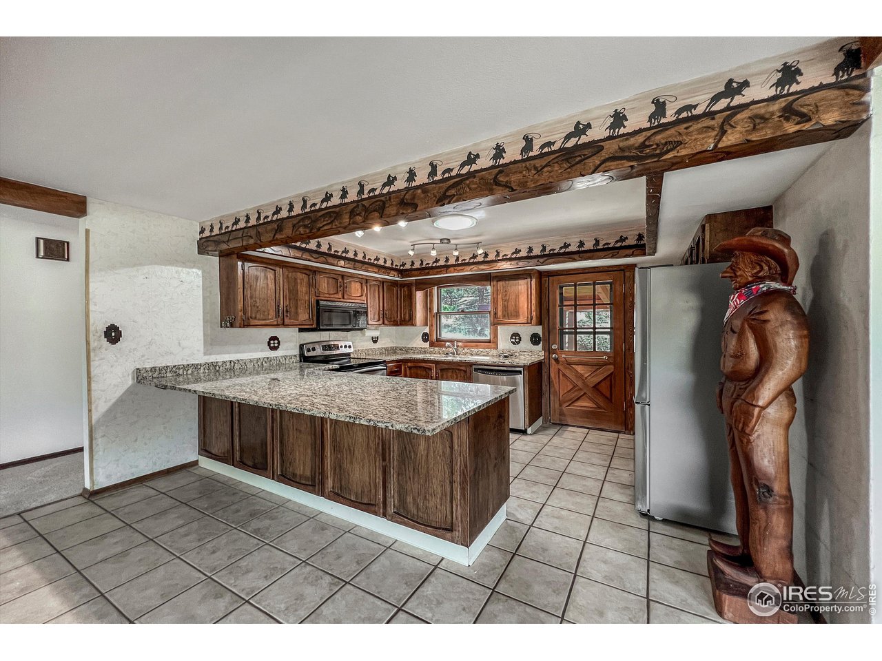 135 Lake Drive Lyons, CO 80540 - Photo 2 of 39 a kitchen with stainless steel appliances granite countertop a sink a stove and a refrigerator