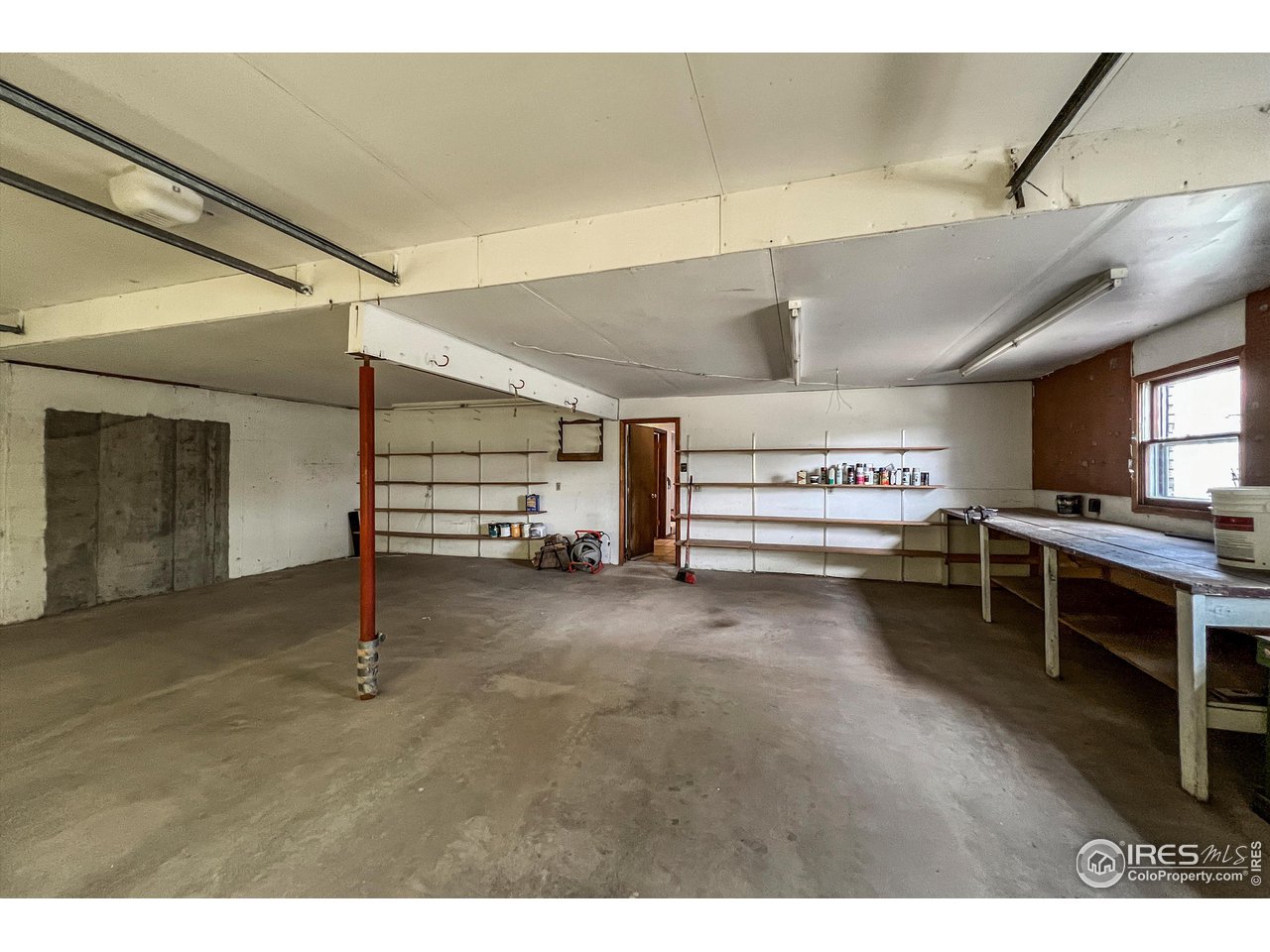 135 Lake Drive Lyons, CO 80540 - Photo 22 of 39 a view of an empty room and window