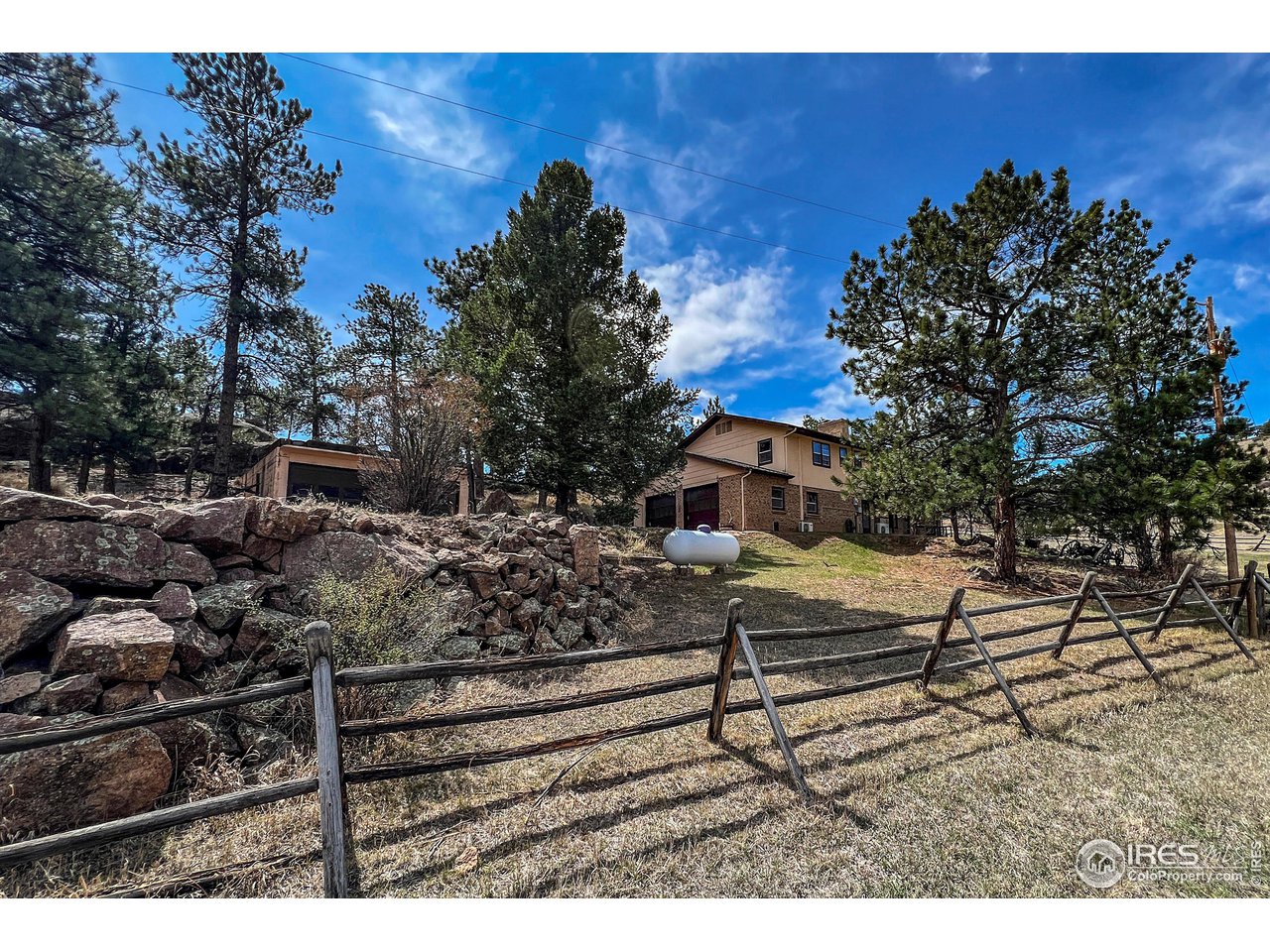 135 Lake Drive Lyons, CO 80540 - Photo 24 of 39 a view of a house with a yard